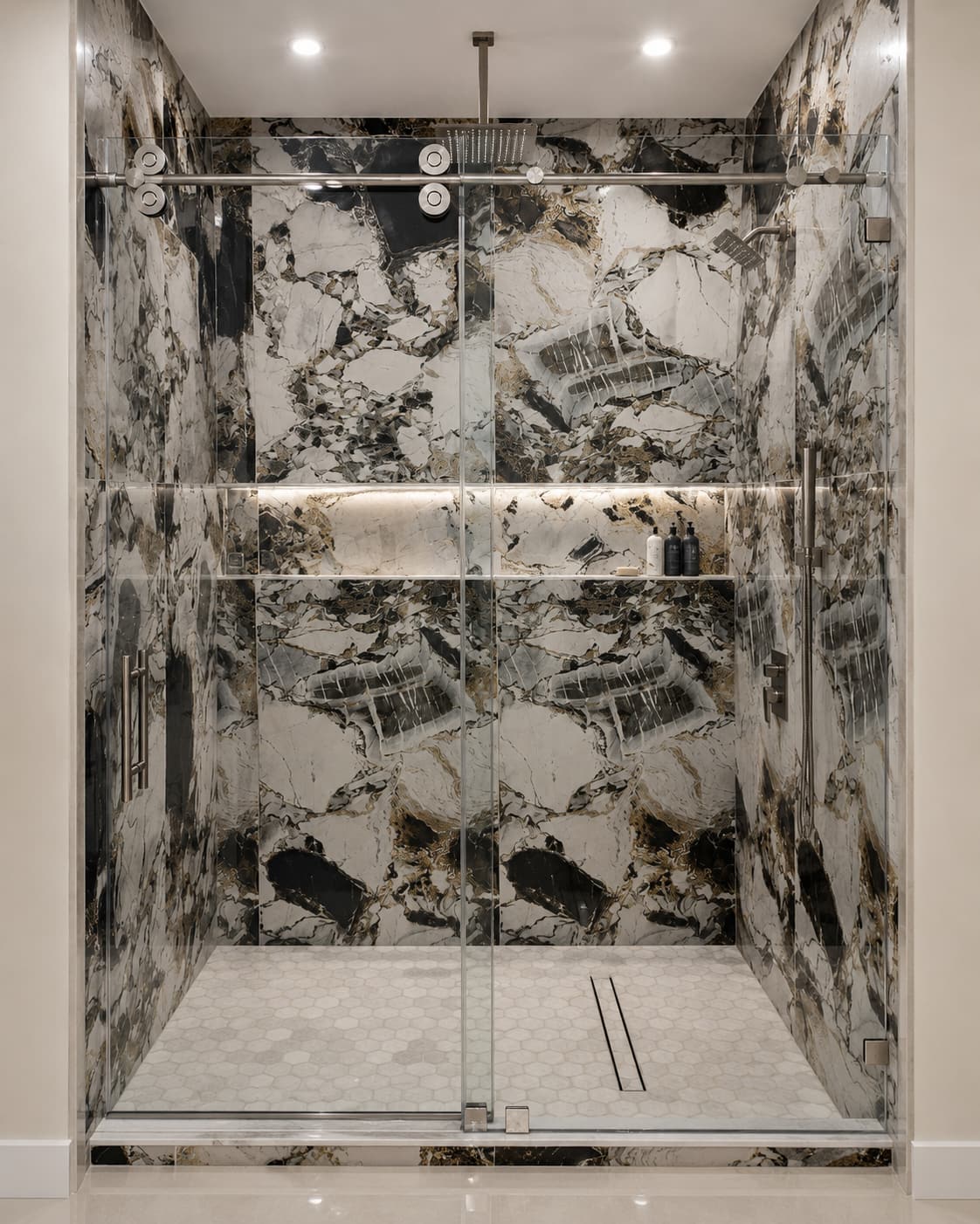 Marble-clad shower enclosure with sliding glass doors